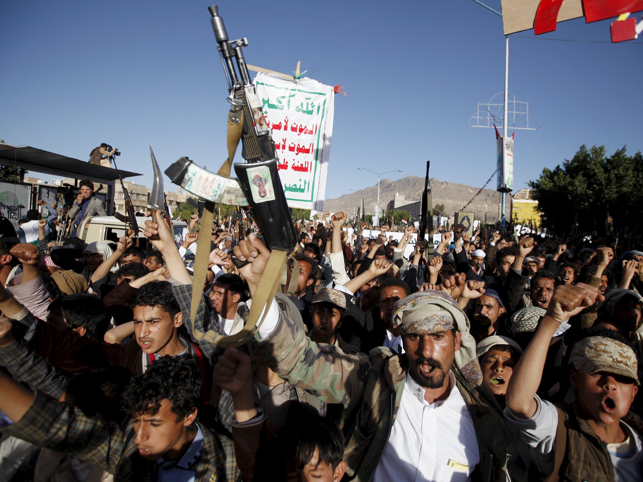 Houthi loyalists shout slogans during a demonstration against Saudi-led strikes in Yemen's capital Sanaa