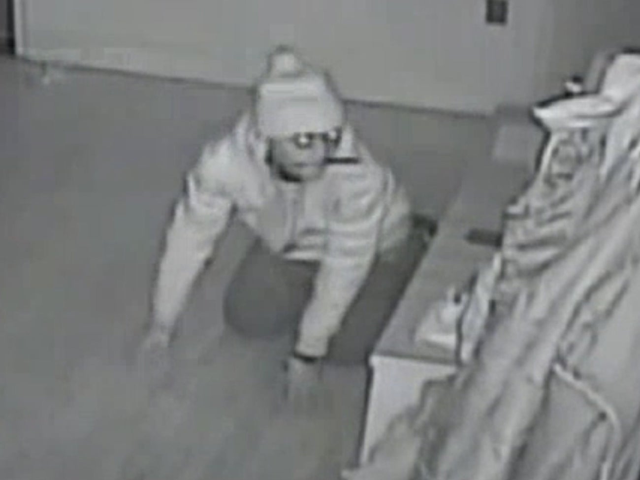 Video shows knife-wielding burglar crawling in bedroom where family were asleep