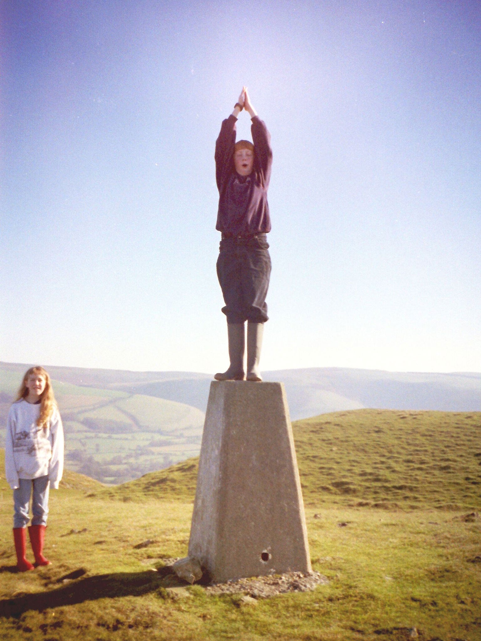 Lyall doing yoga on top of Pen-y-Fan, with Holly, 1992