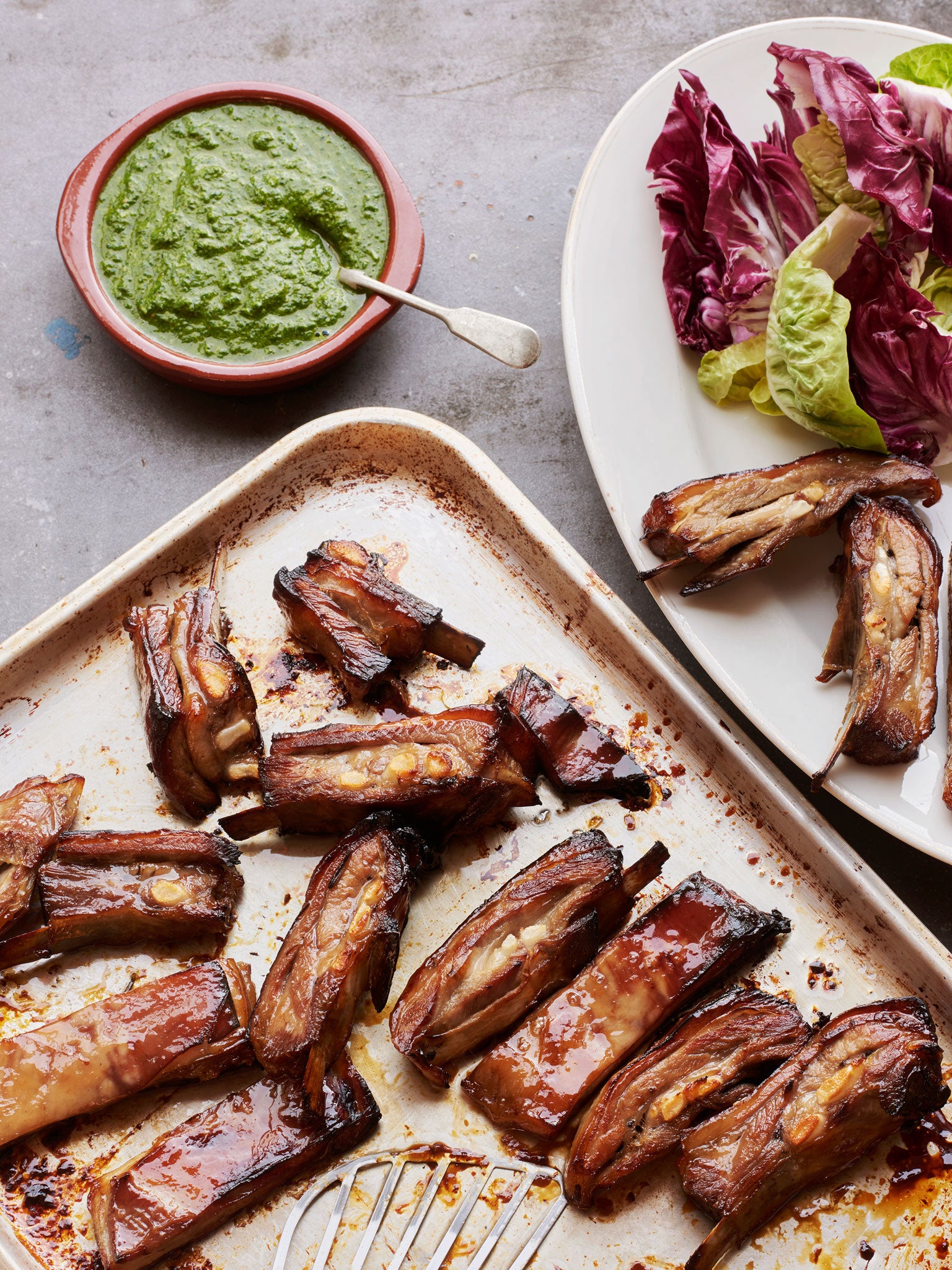 Sticky lamb ribs and green sauce