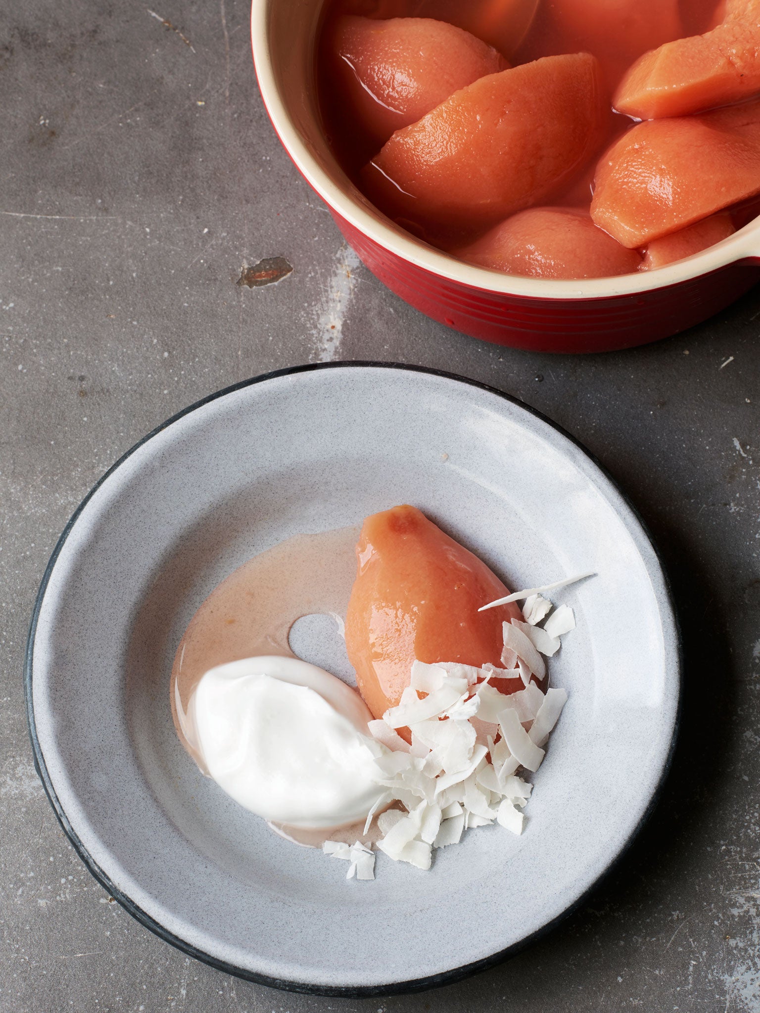 Quince served with coconut yoghurt and a scattering of coconut flakes