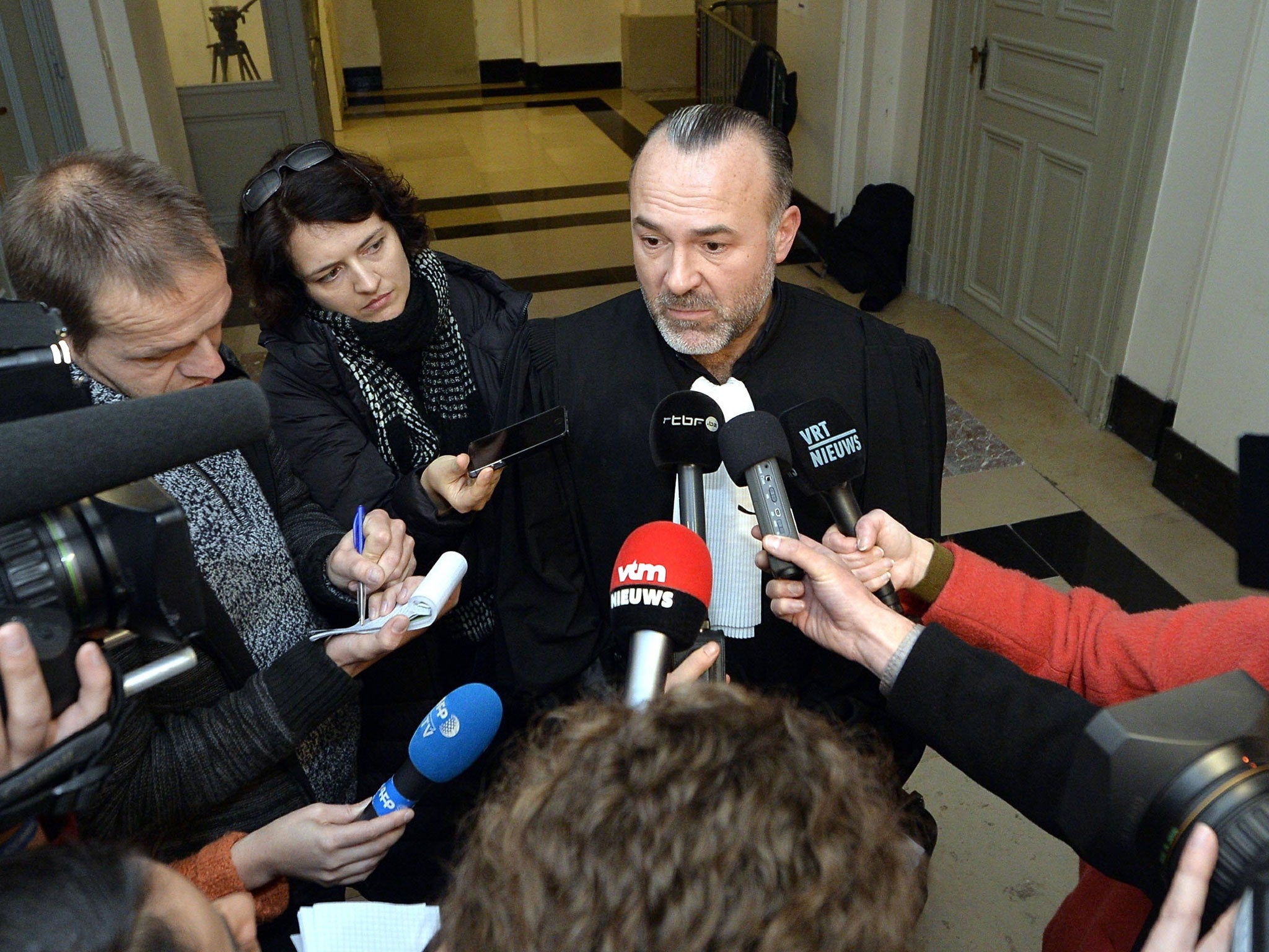 Lawyer Olivier Martins talks to the press, during the appearance of suspect Ali O. at the council chamber of the courthouse in Brussels, on November 27, 2015.