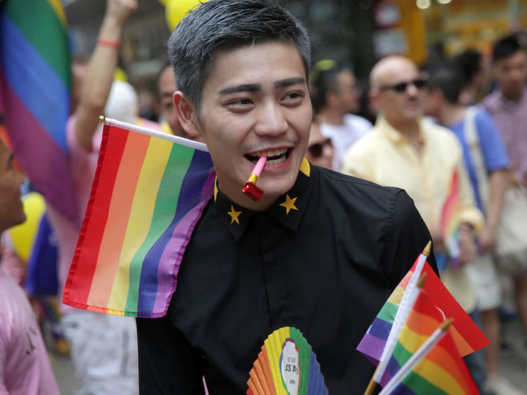 People take part in the Lesbian, Gay, Bi-sexual and Transgender (LGBT) parade in Hong Kong on November 6, 2015.