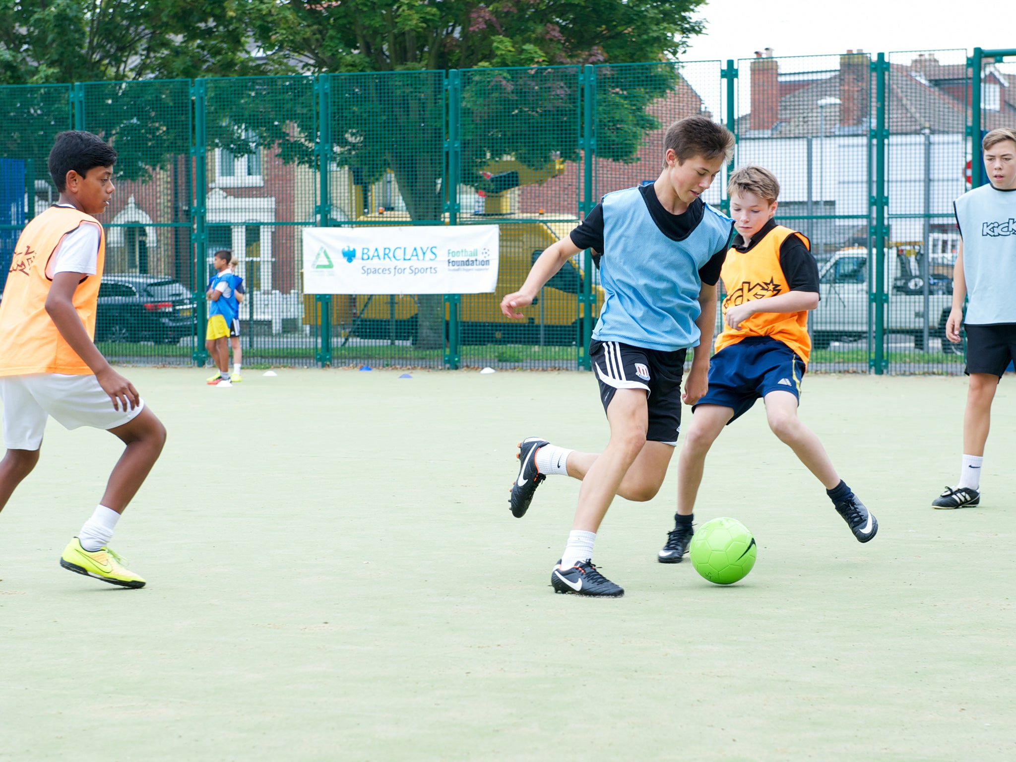 A group of youngsters play on the Bransbury Park pitch in Portsmouth funded by Barclays and the Football Foundation
