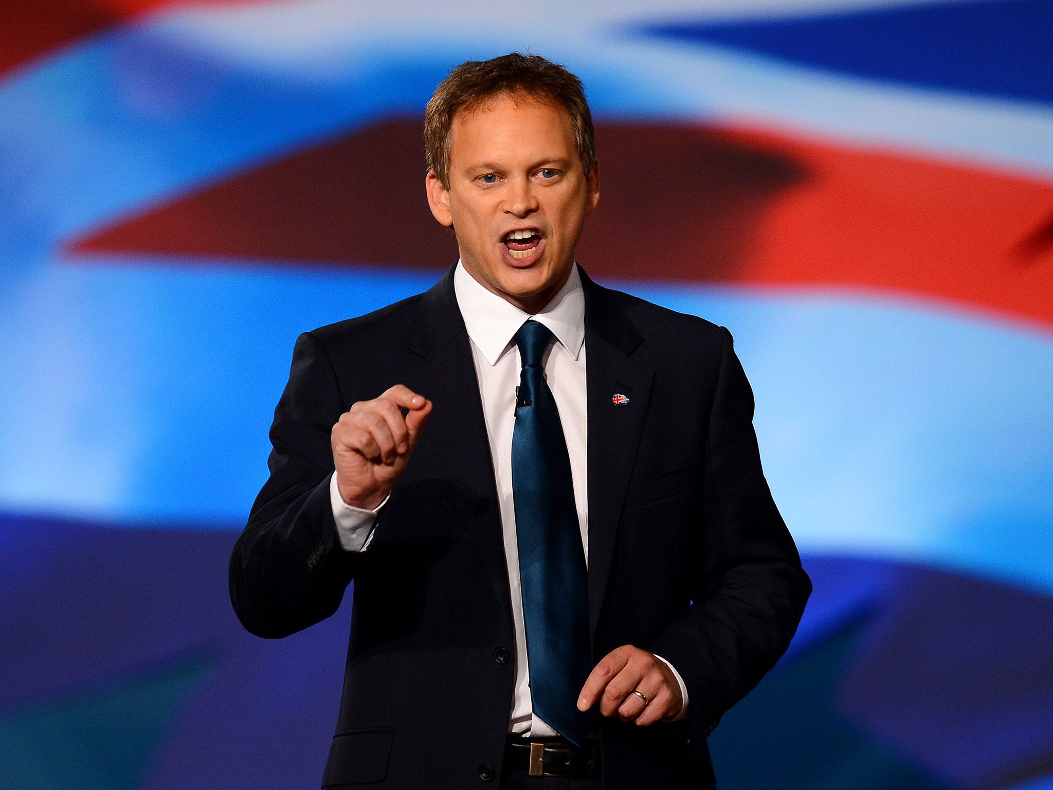 Co-Chairman of the Conservative Party Grant Shapps gestures as he speaks during the opening day of the annual Conservative Party Conference at the ICC in Birmingham, central England on October 7, 2012.