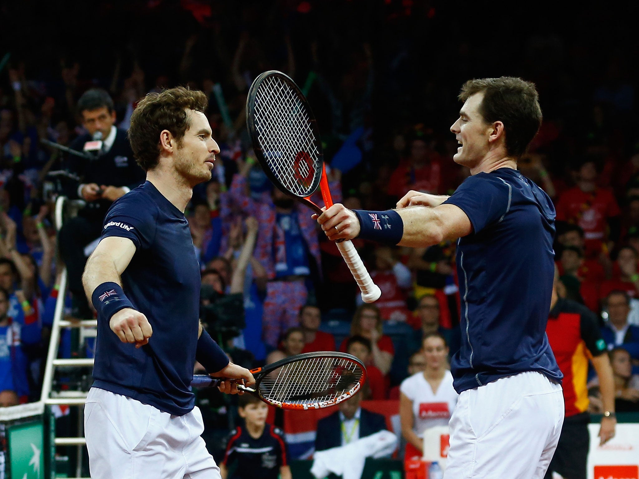 Andy Murray celebrates with brother Jamie after beating Steve Darcis and David Goffin