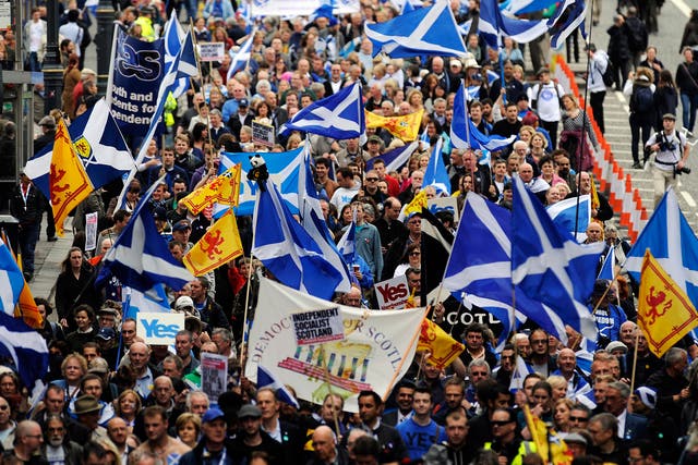 Pro-independence supporters march in Edinburgh on September 21, 2013 for a march and rally in support of a yes vote in the Scottish Referendum
