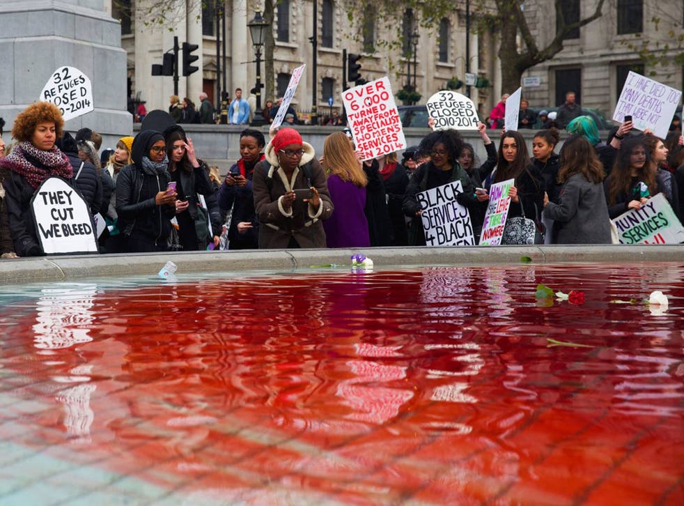 Trafalgar Square fountains dyed blood red as Sisters Uncut demonstrators protest against budget cuts to domestic violence services