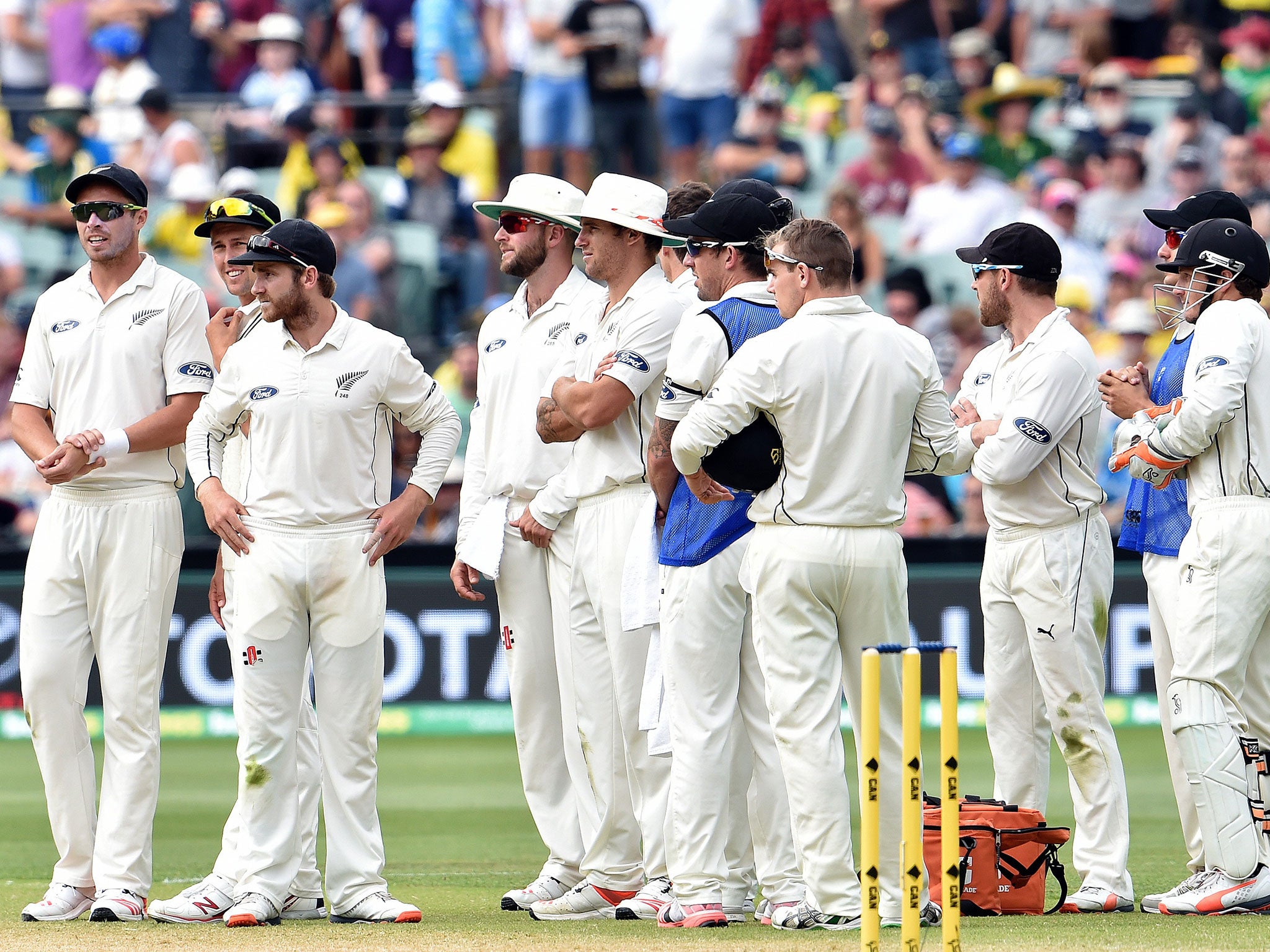 New Zealand players wait for the third umpire after appealing for a catch off Nathan Lyon