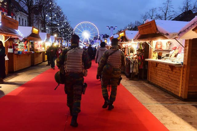 Soldiers patrol a Christmas market in Brussels