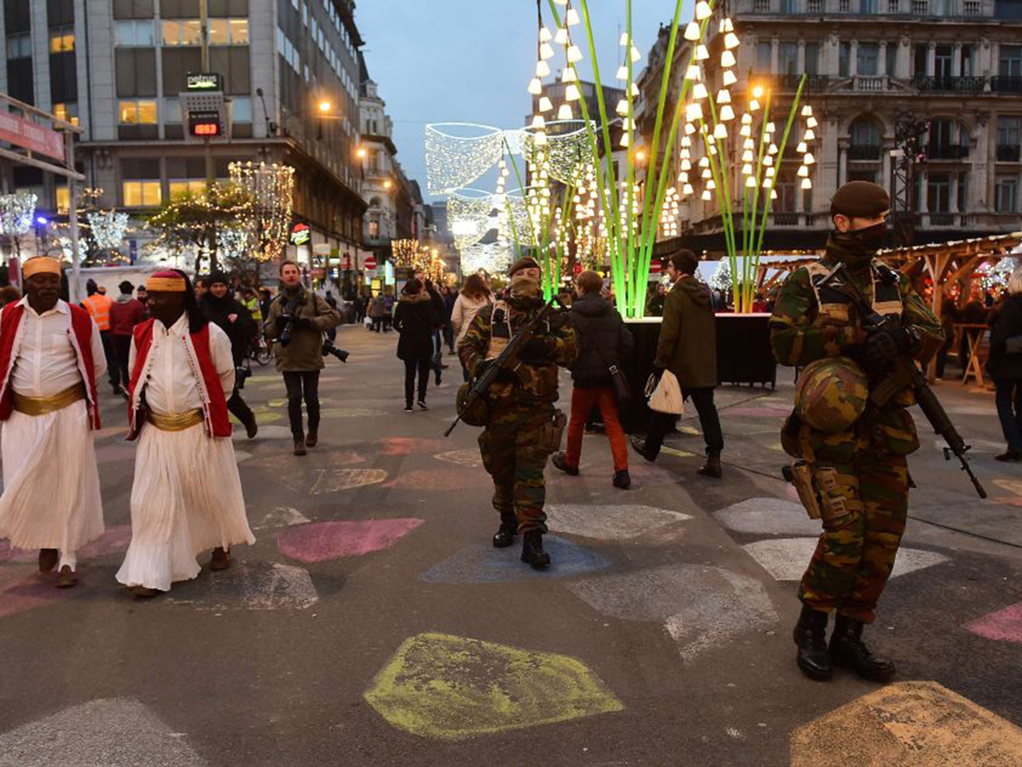 Belgian soldiers patrol during the opening night of the annual Christmas market on November 27, 2015 in Brussels.