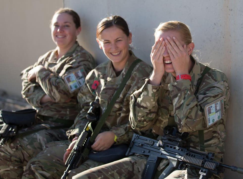 British female troops share a joke aat Kandahar airfield in Afghanistan