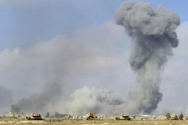 Smoke rises from Islamic State positions following a U.S.-led coalition airstrike