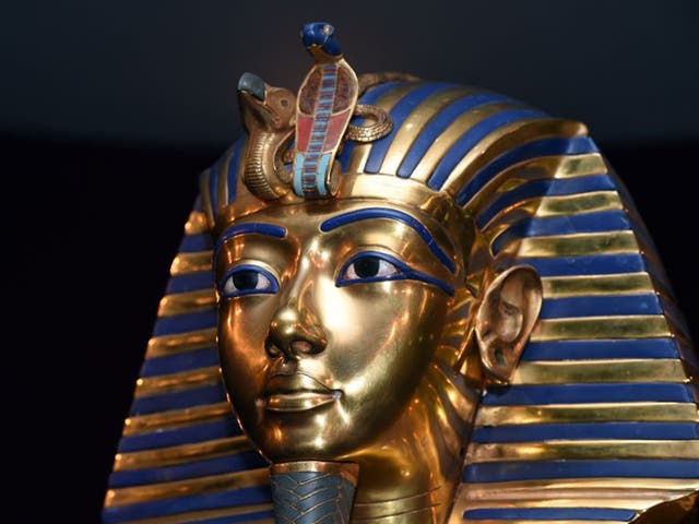 Hieroglyphics on the mask appear to have been inscribed on top of earlier writing