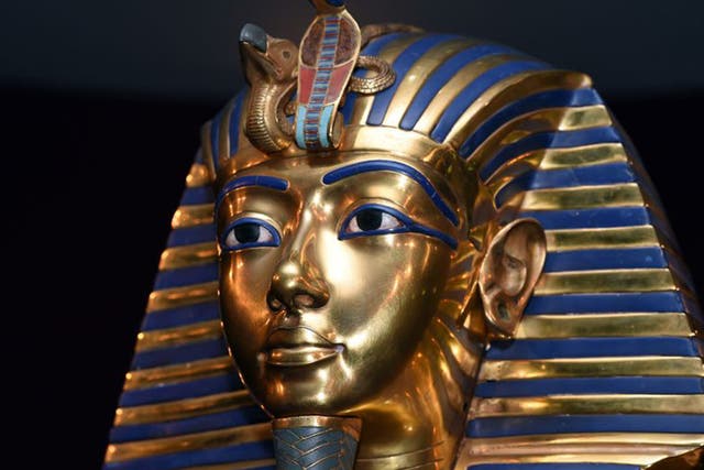 Hieroglyphics on the mask appear to have been inscribed on top of earlier writing