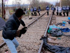 Clashes as Macedonia begins building border fence to keep refugees out