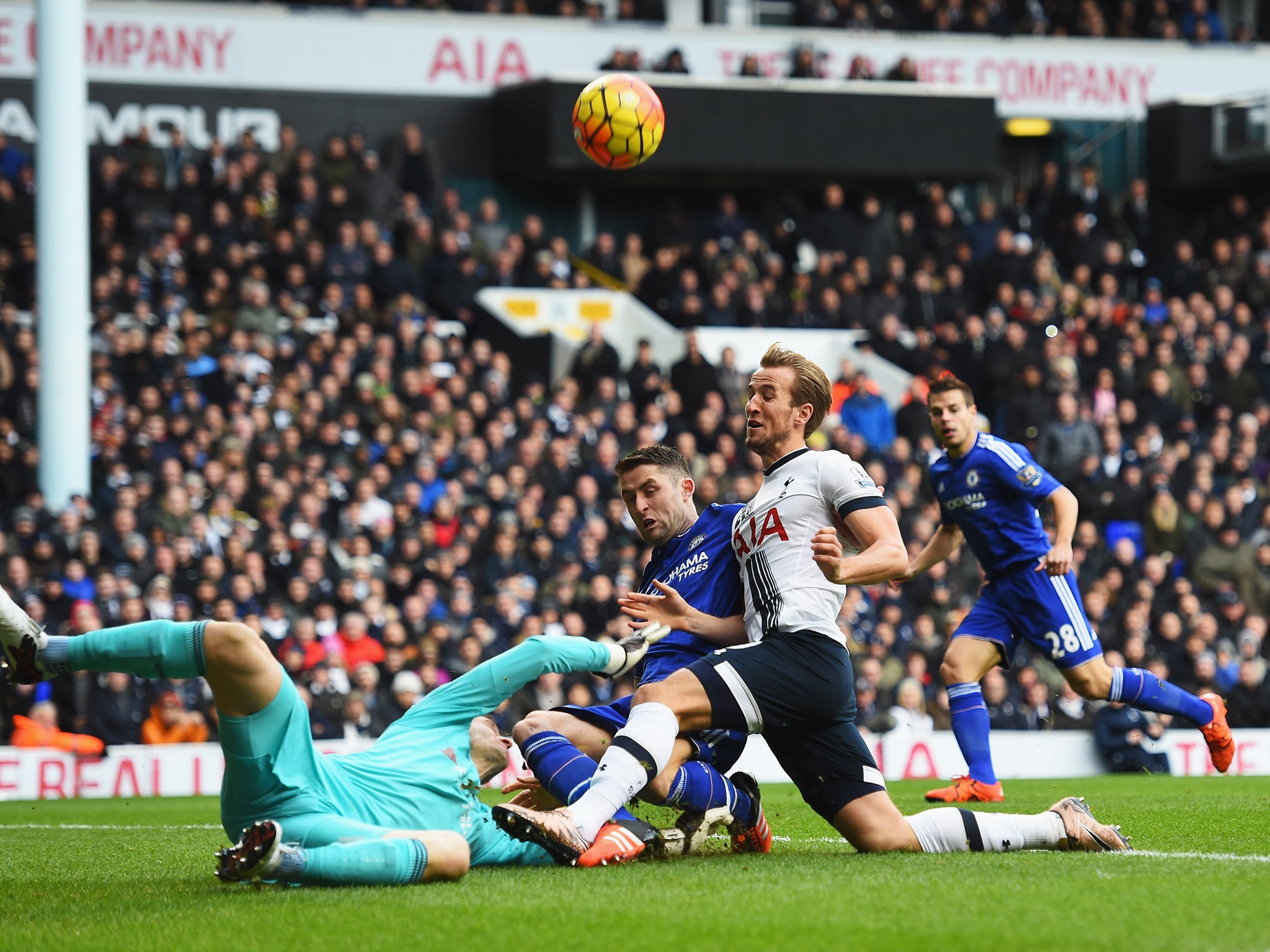 Harry Kane is foiled by Chelsea goalkeeper Asmir Begovic and defender Gary Cahill