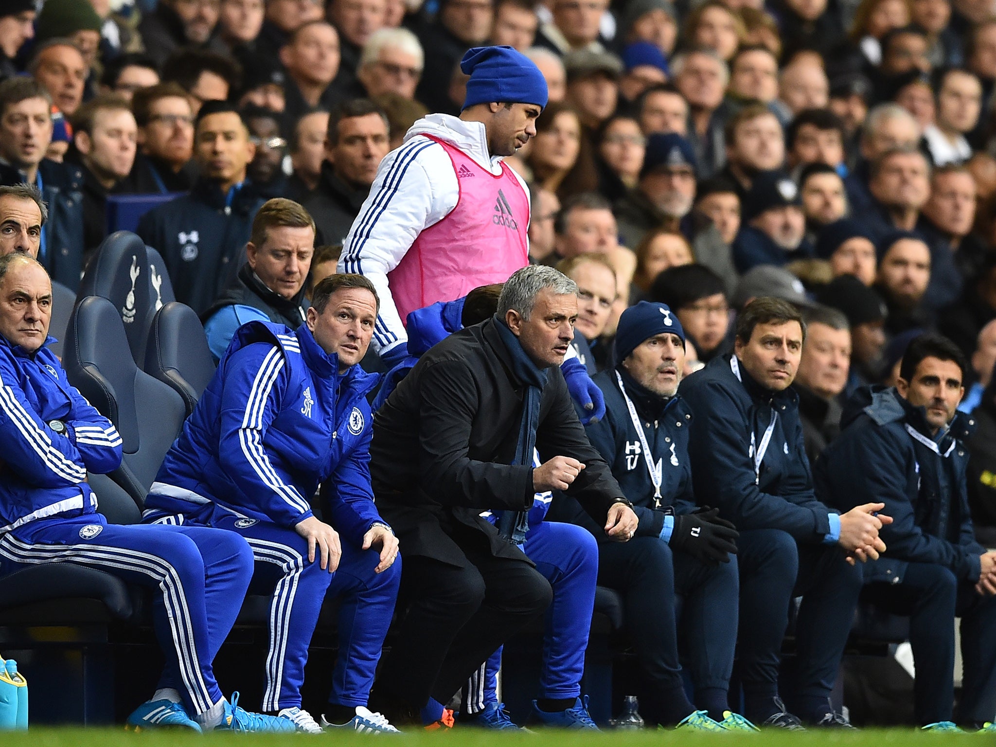 Diego Costa on the bench in the pink bib behind Jose Mourinho