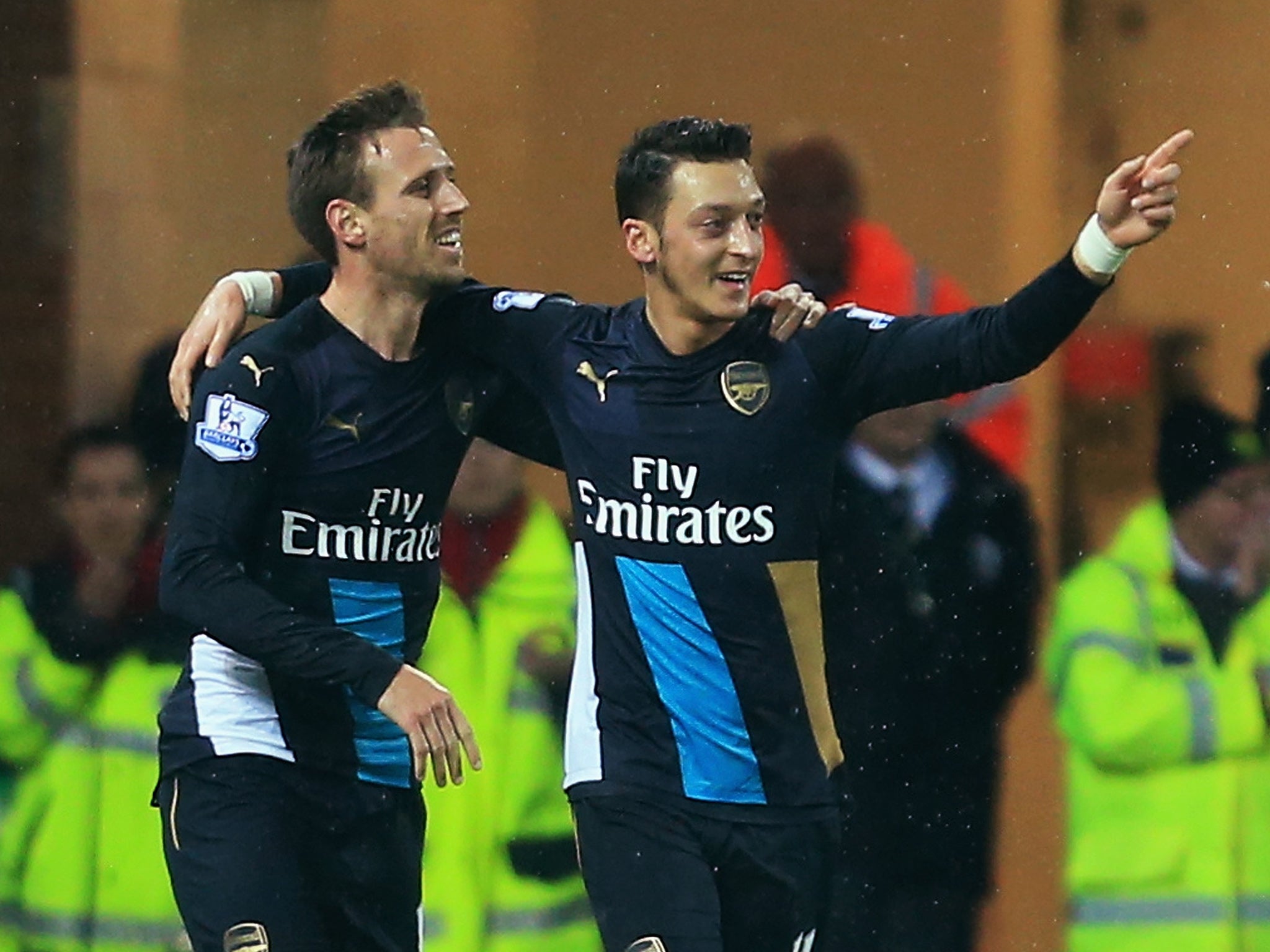 Mesut Ozil celebrates his goal with Nacho Monreal (left)