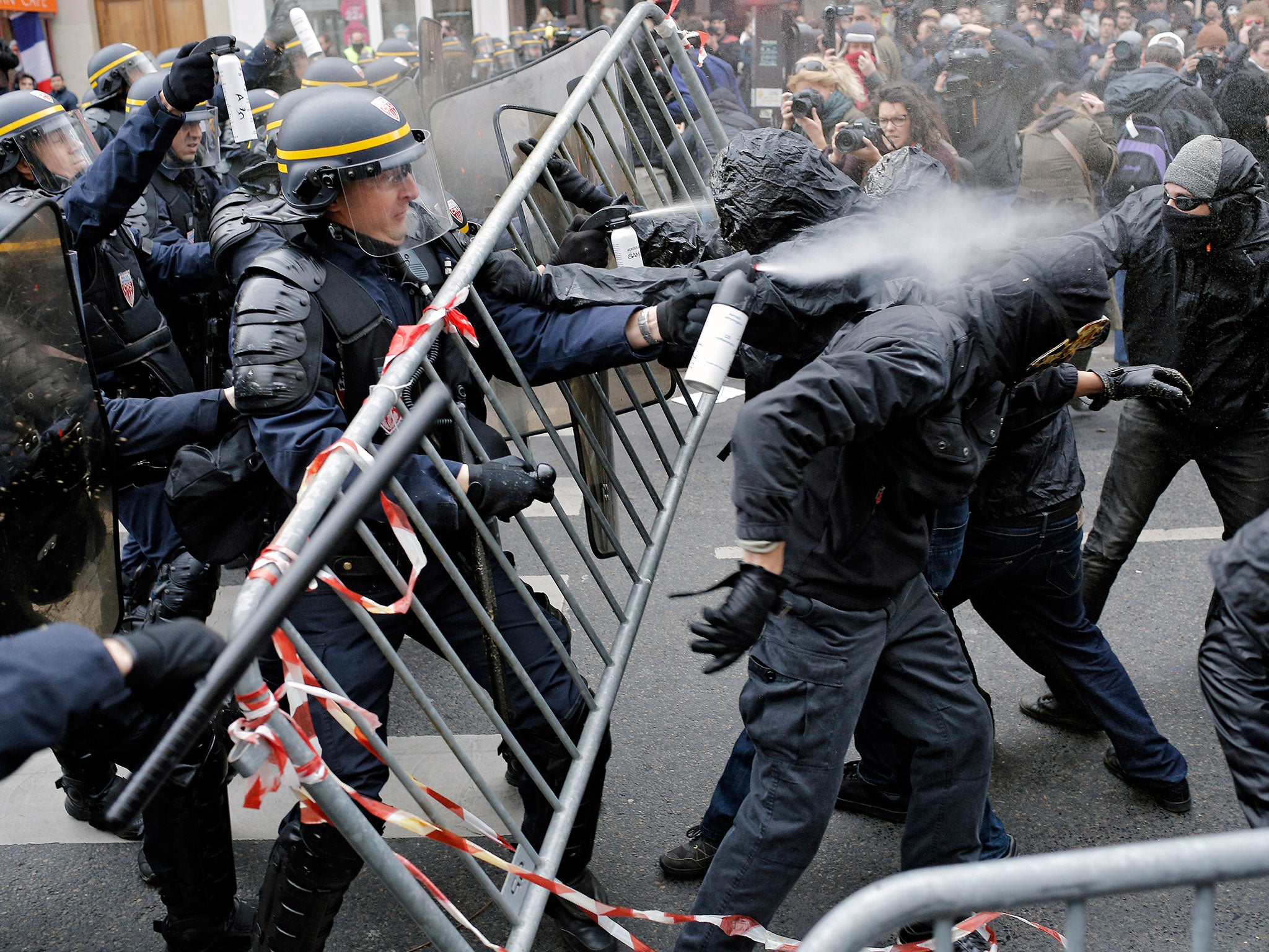 Policemen fight with climate change activists at the Place de la Republique in Paris