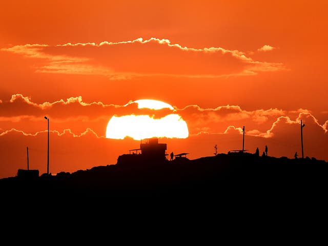 Turkish soldiers overlooking the Syrian town of Kobani. Kurdish forces have captured regions near the Turkish frontier, but Ankara says it will resist a further Kurdish advance with military force