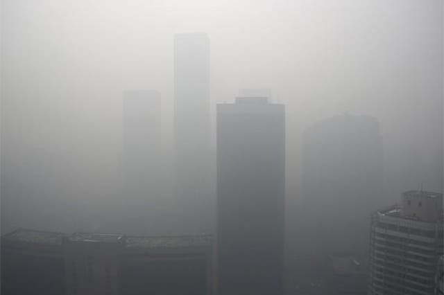 High-rise buildings are seen during a heavily polluted day in Beijing