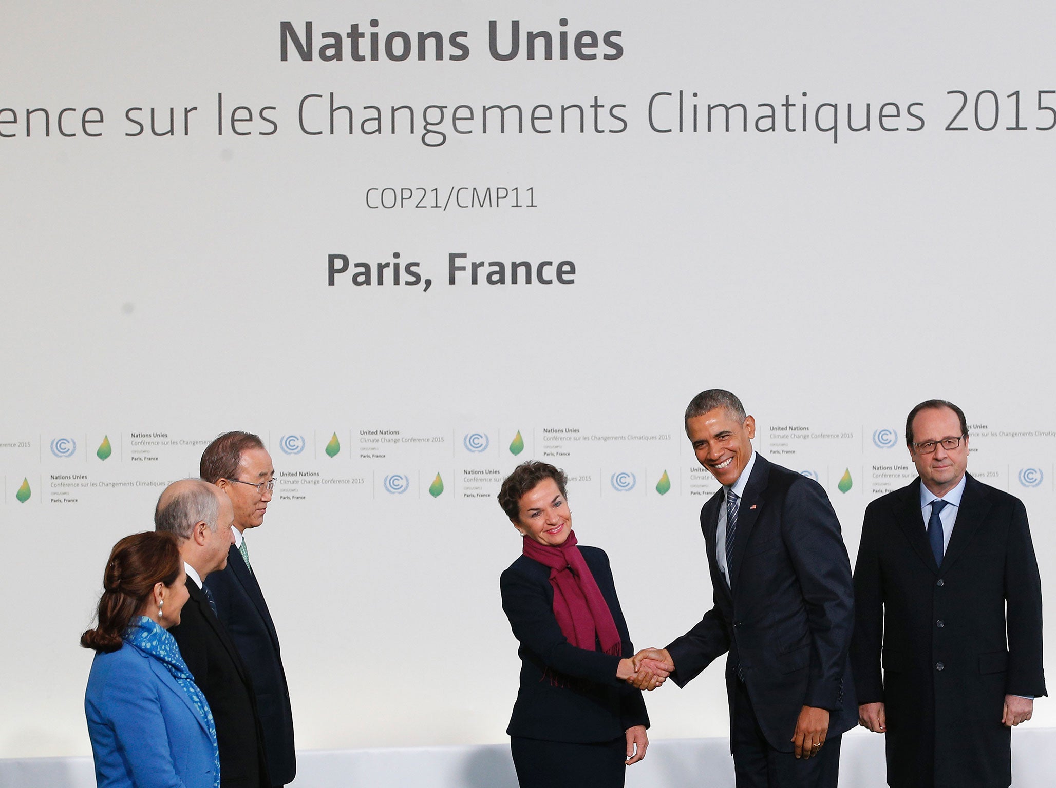 .S. President Barack Obama (2nd R) shakes hand with Executive Secretary of the UN Framework Convention on Climate Change Christiana Figueres, as United Nations Secretary General Ban Ki-moon (3rd L), French Environement minister Segolene Royal (L), French Foreign minister Laurent Fabius (2nd L) and French President Francois Hollande (R) looks on, as they arrive for the COP21, United Nations Climate Change Conference, in Le Bourget, outside Paris