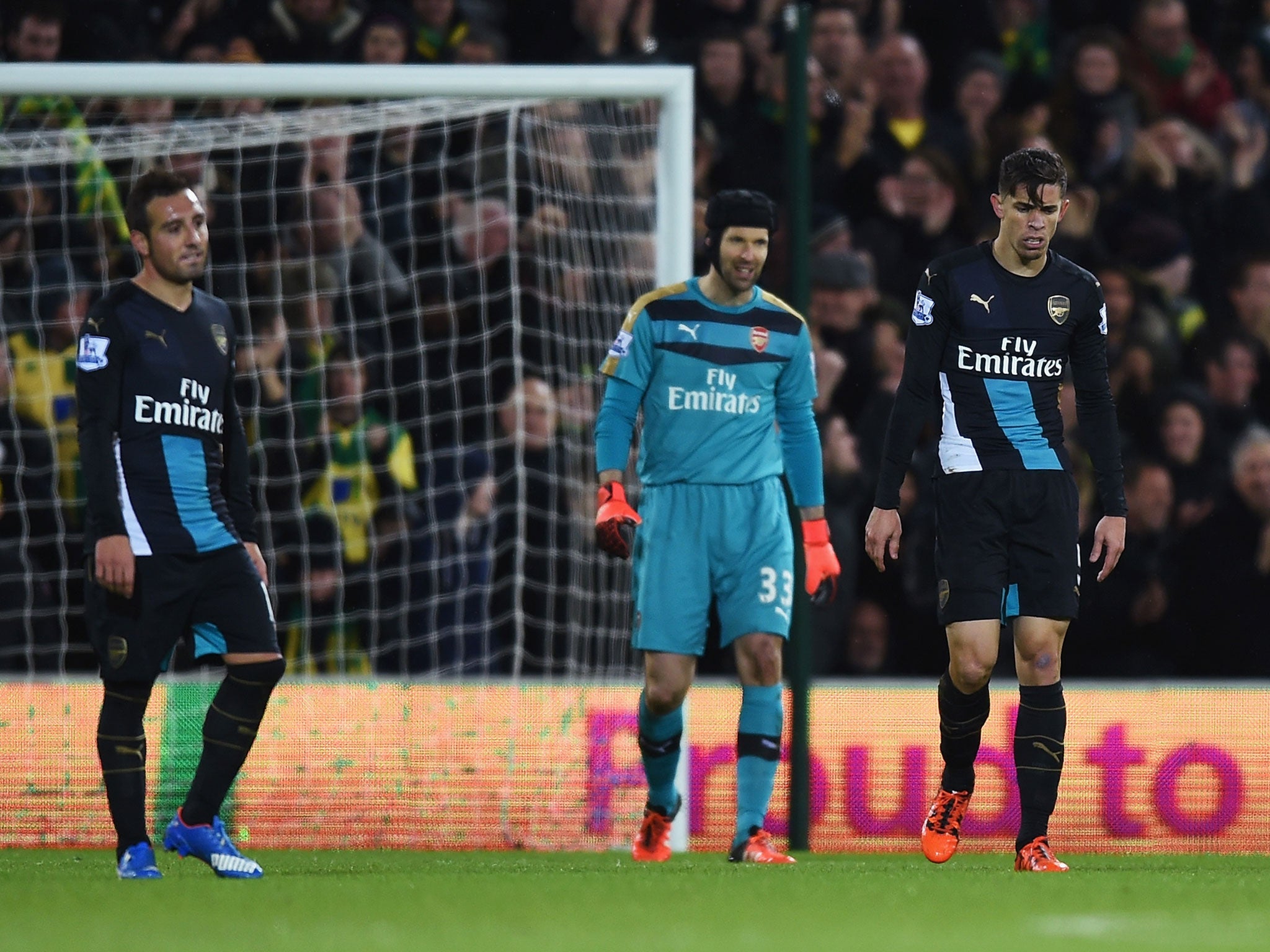 Santi Cazorla, Petr Cech and Gabriel Paulista react to conceding a goal against Norwich