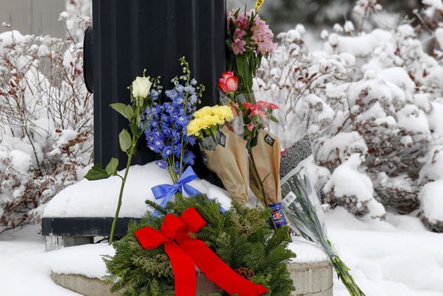 Flowers left at an intersection near the Planned Parenthood clinic in Colorado Springs. Gunman Robert L. Dear stormed the clinic on Friday and killed three people, including a police officer