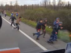 Watch: Hungarian driver swerves lorry at refugees in Calais 'warzone'