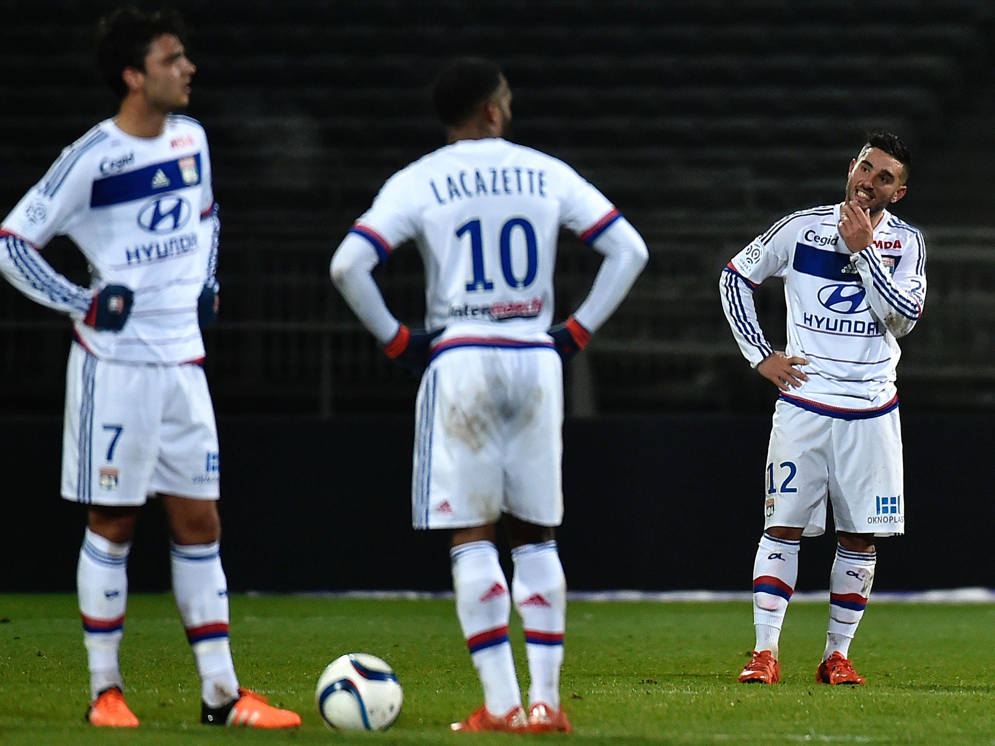 Lyon's Clement Grenier, Alexandre Lacazette and Jordan Ferri react after conceding to Marseille