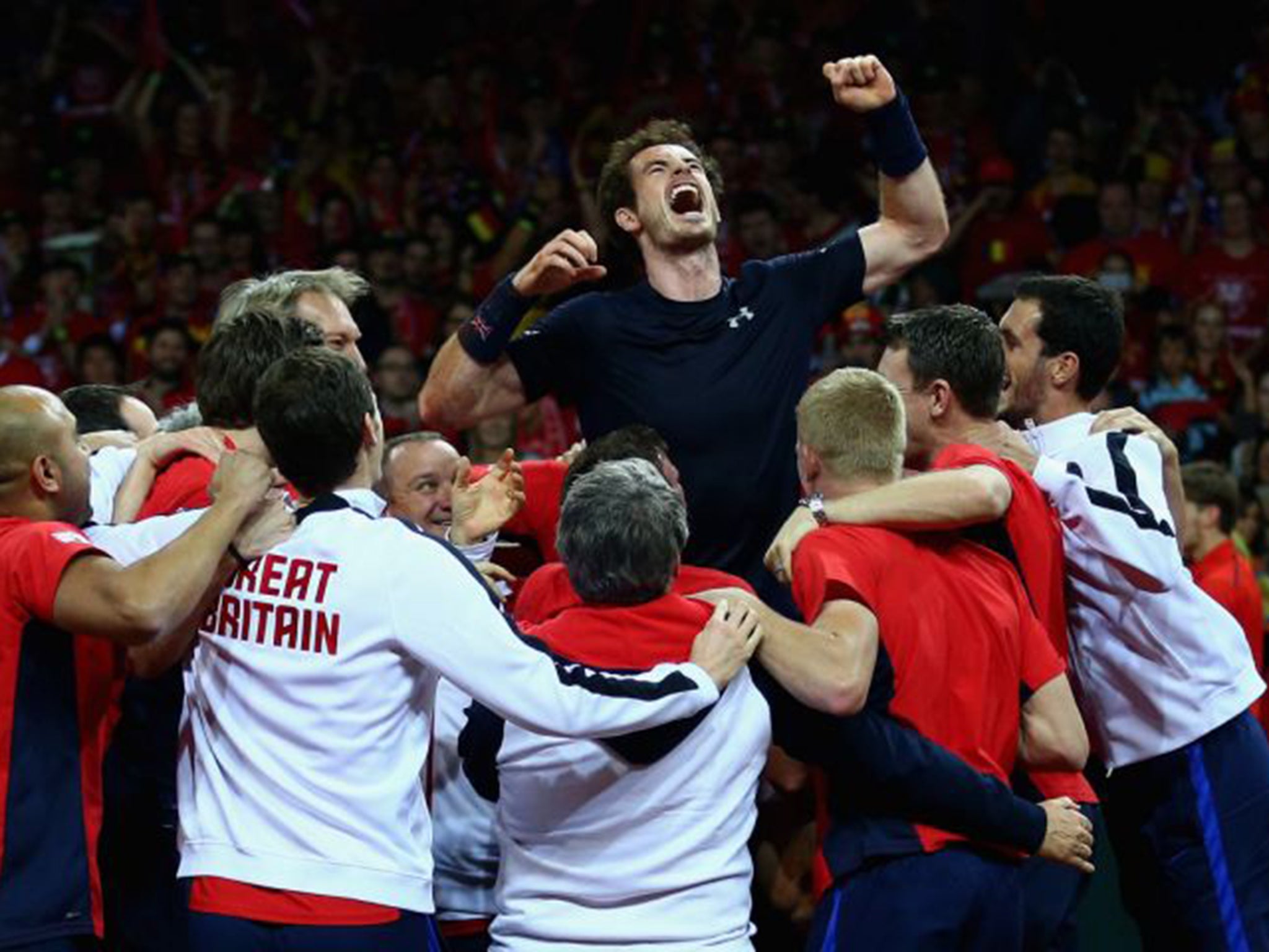 Andy Murray celebrates with his team after winning his match against David Goffin of Belgium to clinch the Davis Cup