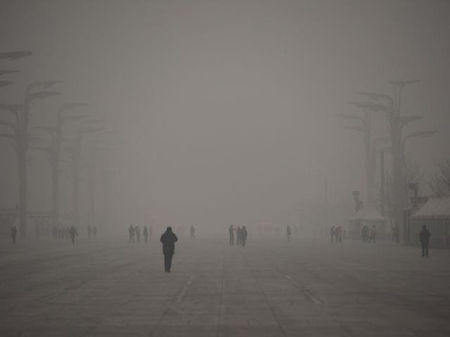 A thick grey haze shrouded Beijing, with the concentration of PM 2.5, harmful microscopic particles that penetrate deep into the lungs, on 1 December