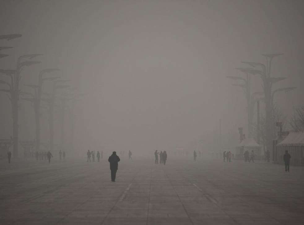 A thick grey haze shrouded Beijing, with the concentration of PM 2.5, harmful microscopic particles that penetrate deep into the lungs, on 1 December