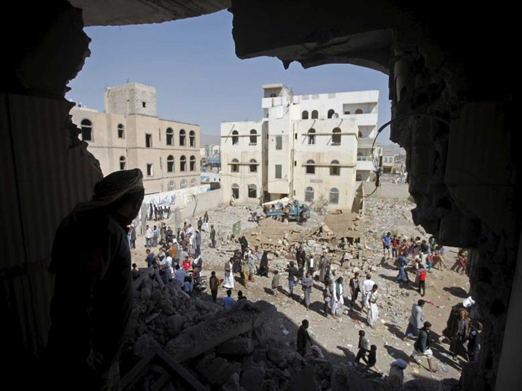 A man surveys the damage in a Sanaa neighbourhood