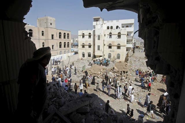 A man surveys the damage in a Sanaa neighbourhood