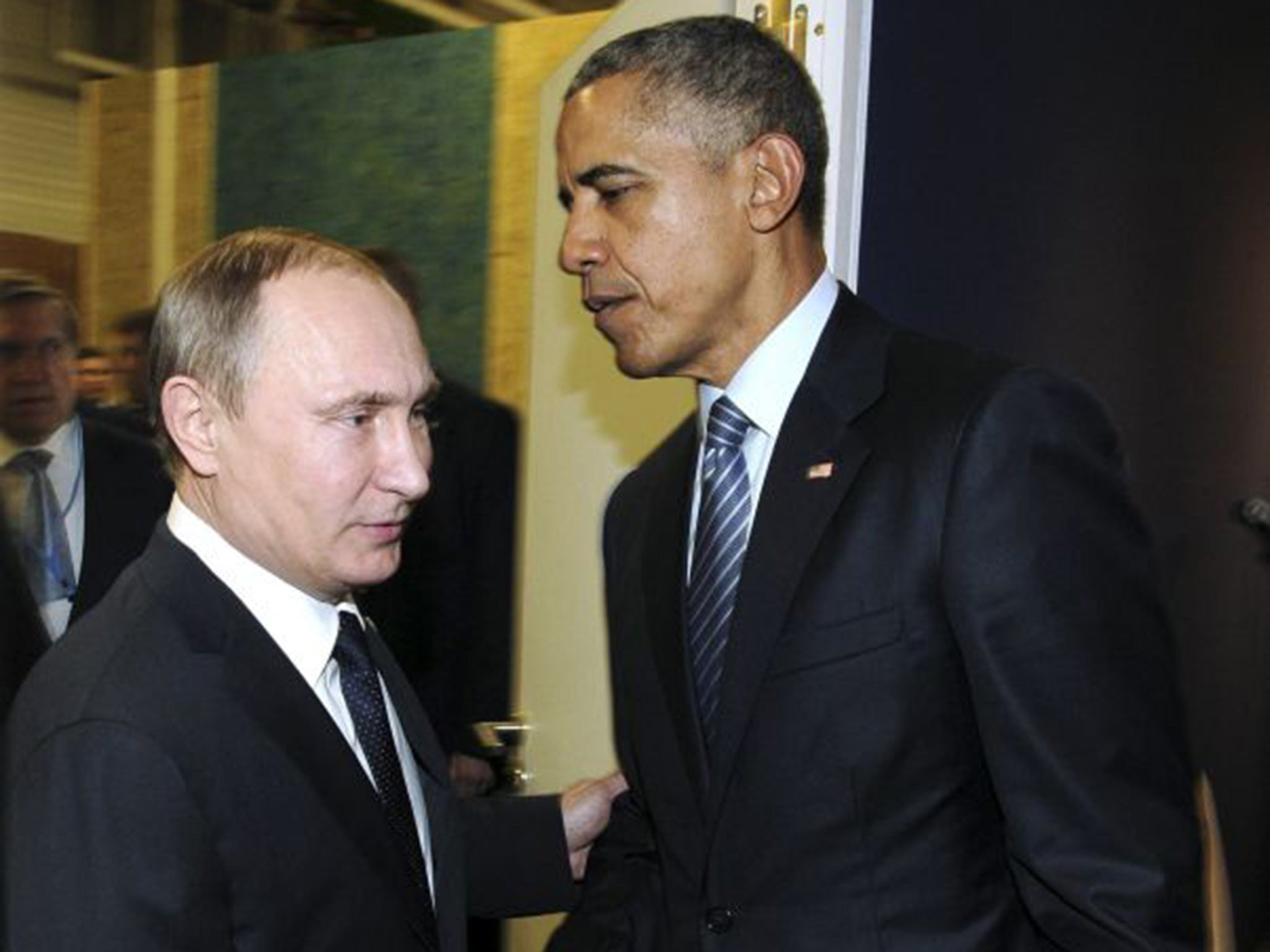 Russian President Vladimir Putin meets U.S. President Barack Obama during the World Climate Change Conference 2015