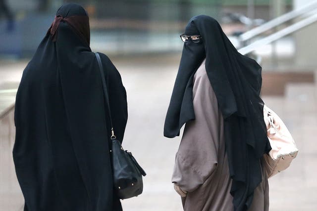 Two women wearing Islamic veils