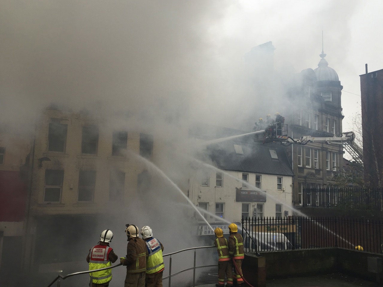 Tyne and Wear firefighters tackle the serious fire that broke out in a shop on Cross Street