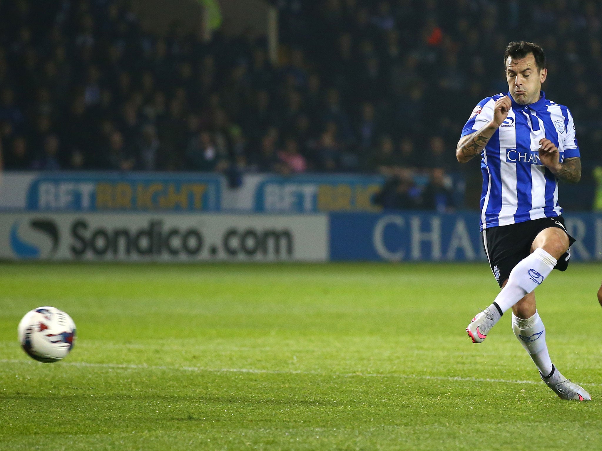 Sheffield Wednesday's Ross Wallace scores against Arsenal