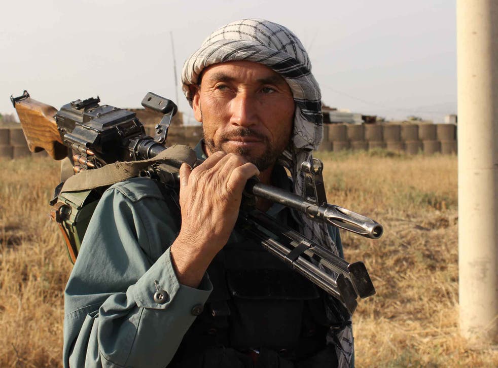 An Afghan policeman in Kunduz earlier this year. Locals are angry that the Taliban has still not been dislodged