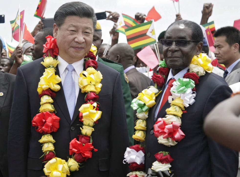 Chinese President Xi Jinping was greeted by Robert Mugabe in Harare