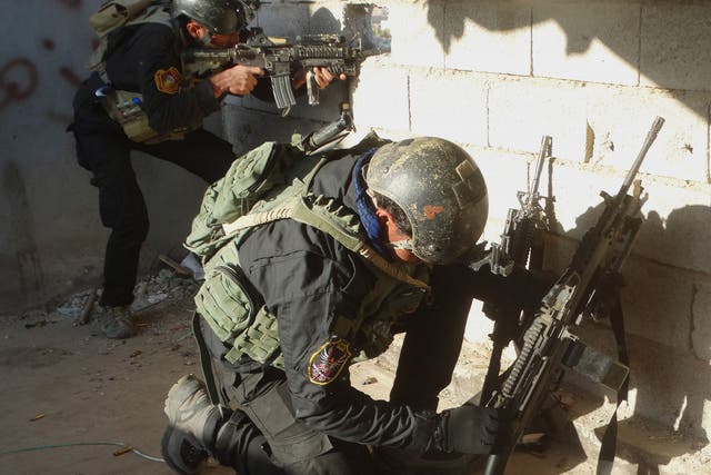 Iraqi security forces take combat position at the front-line at Ramadi supported by U.S.-led coalition airstrikes