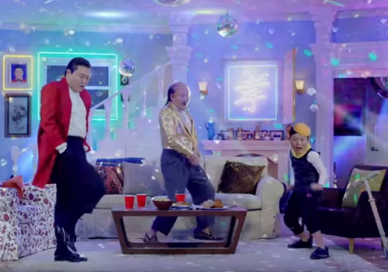 Psy as himself, his father and his son in yet another crazy video
