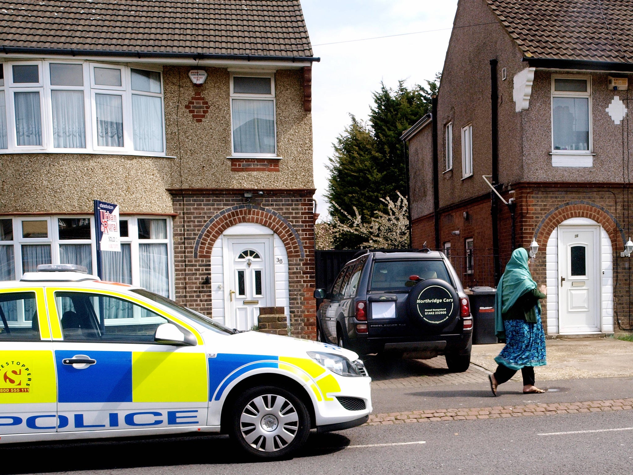 Police outside a house in Luton raided by an anti-terrorist unit in Luton in 2012