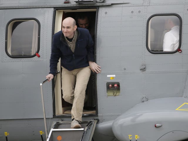 Nicolas Henin embarks the helicopter upon his arrival back in France following 10 months in Isis captivity