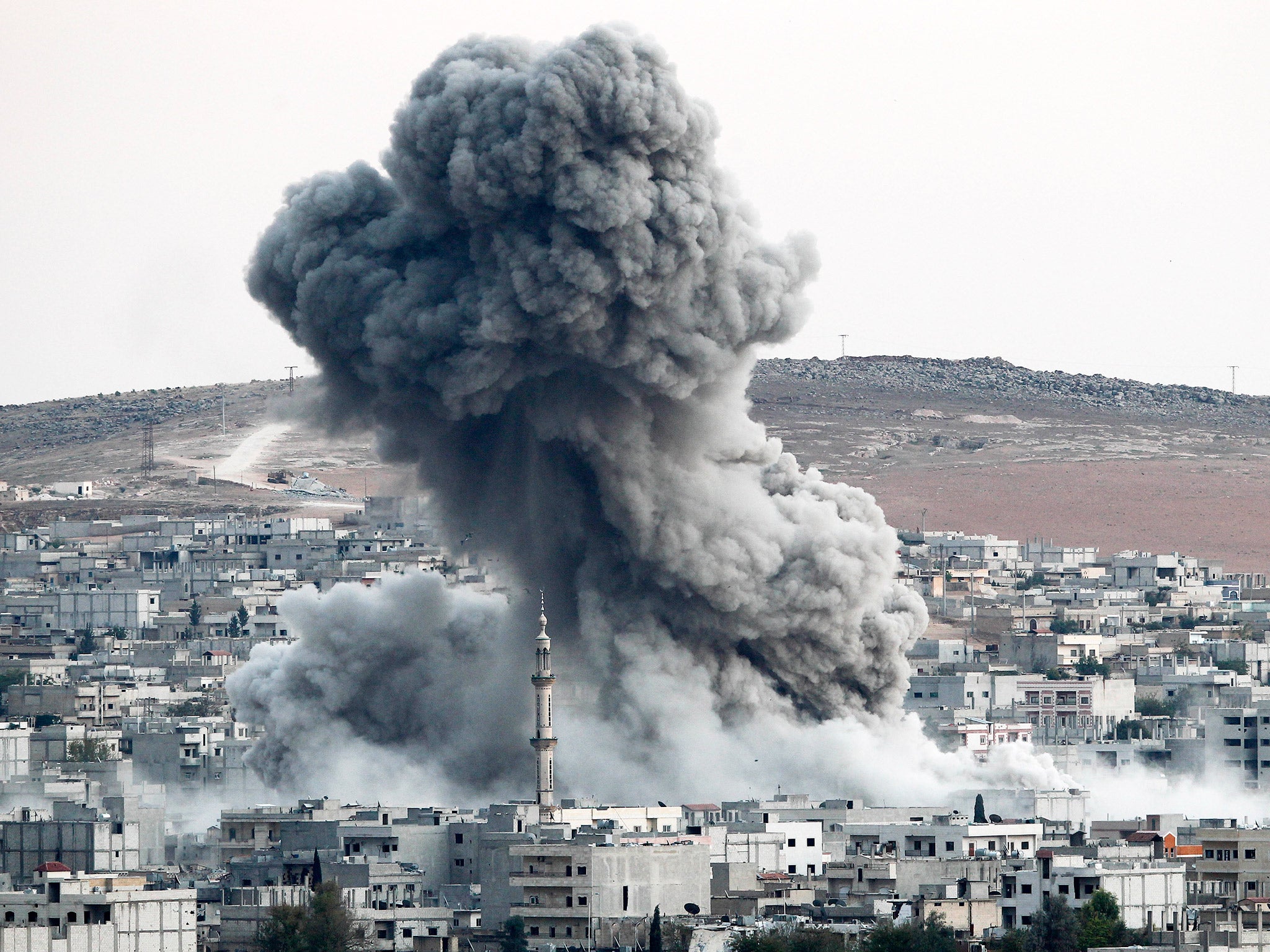 Heavy smoke rises following an air strike by the US-led coalition in Kobani, Syria