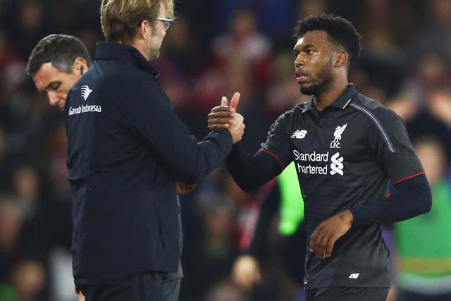 Daniel Sturridge of Liverpool shakes hands with Jurgen Klopp manager of Liverpool as he is substituted