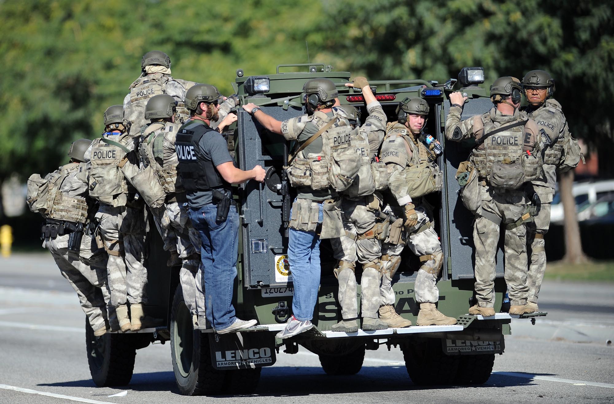 A SWAT vehicle carries police officers near the scene in San Bernardino, California. Doug Saunders/Los Angeles News Group/Associated Press