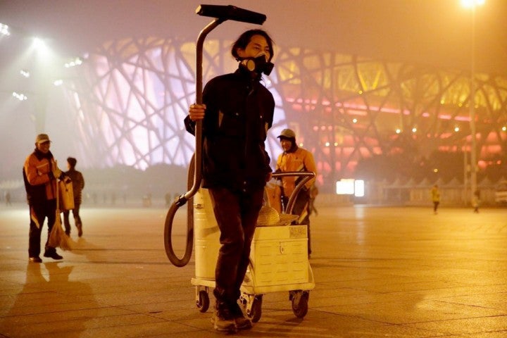 Nut Brother and his vacuum cleaner at the Bird's Nest stadium